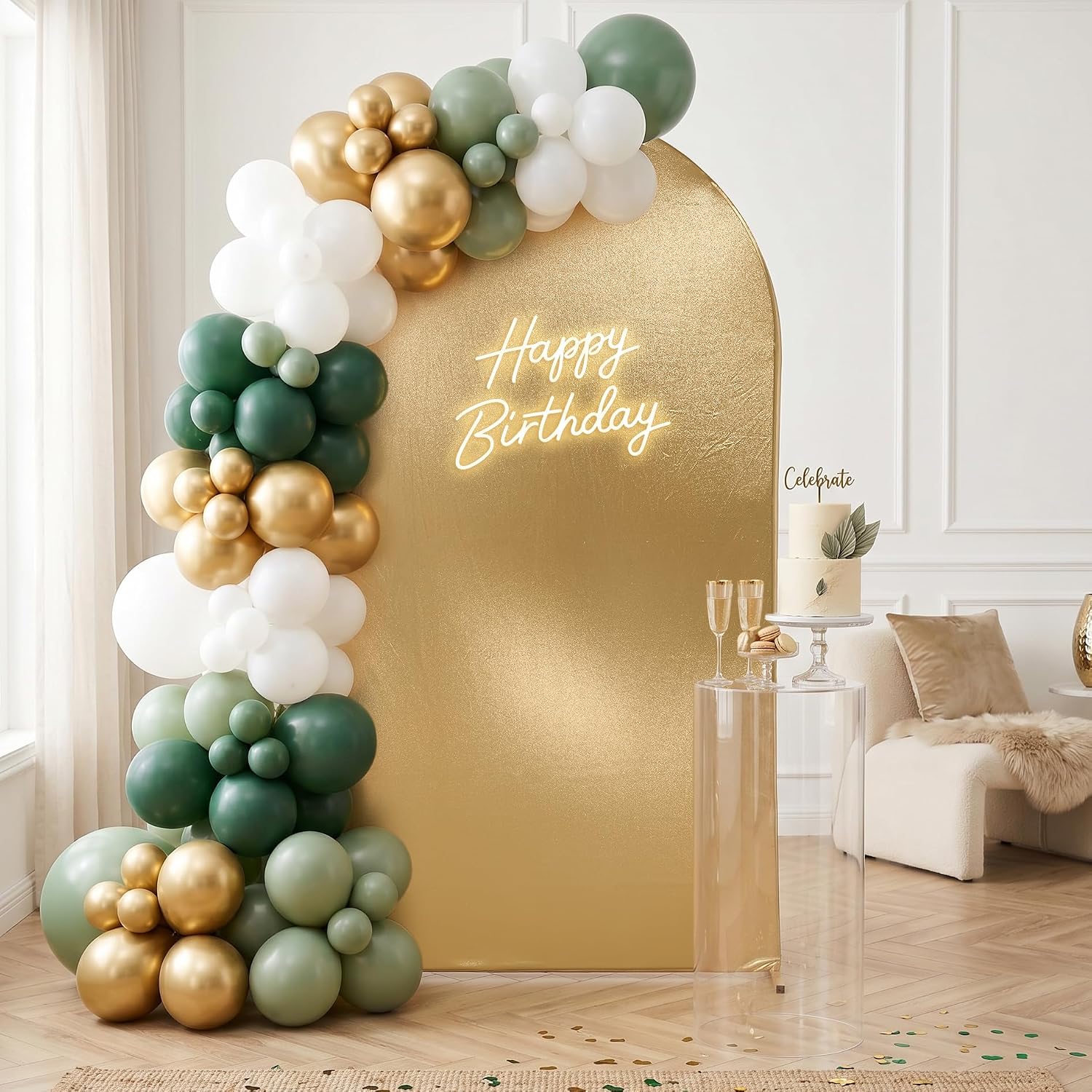 Gold arched backdrop with a neon Happy Birthday sign and a sage green, white and gold balloon garland